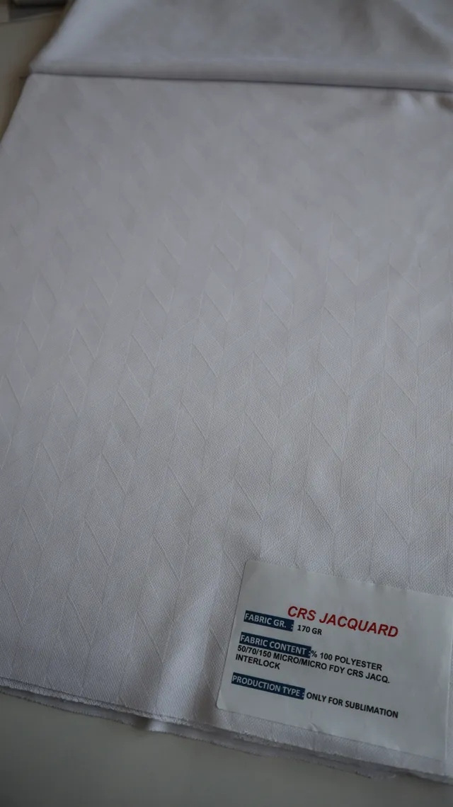 Performance sportswear fabric construction close-up showing knit surface and stretch — 1