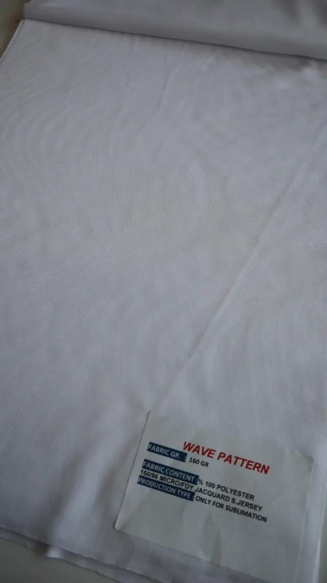 Performance sportswear fabric construction close-up showing knit surface and stretch — 3