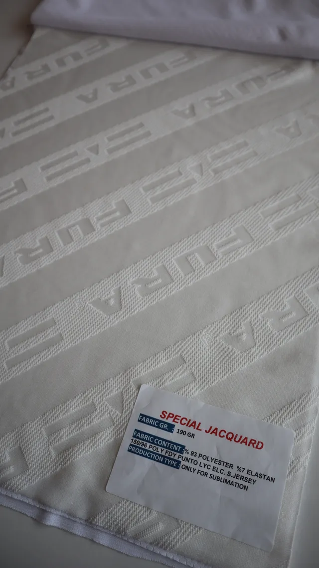 Performance sportswear fabric construction close-up showing knit surface and stretch — 5