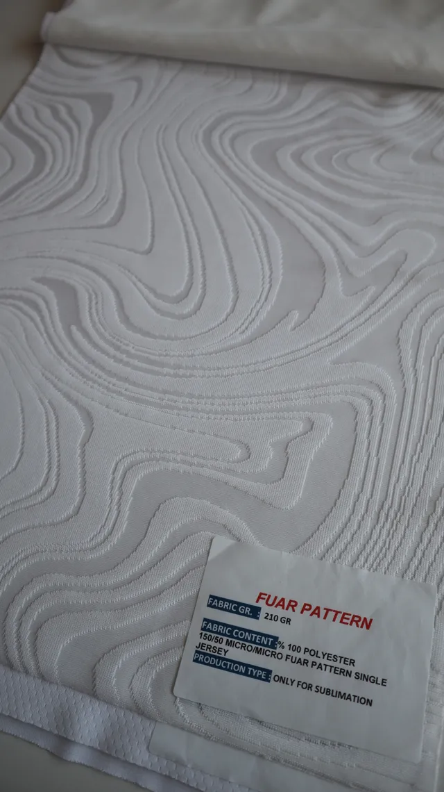 Performance sportswear fabric construction close-up showing knit surface and stretch — 6