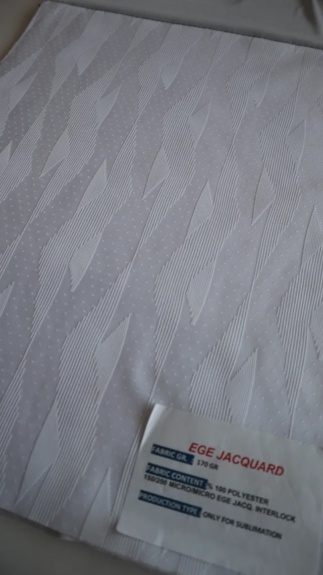 Performance sportswear fabric construction close-up showing knit surface and stretch — 9