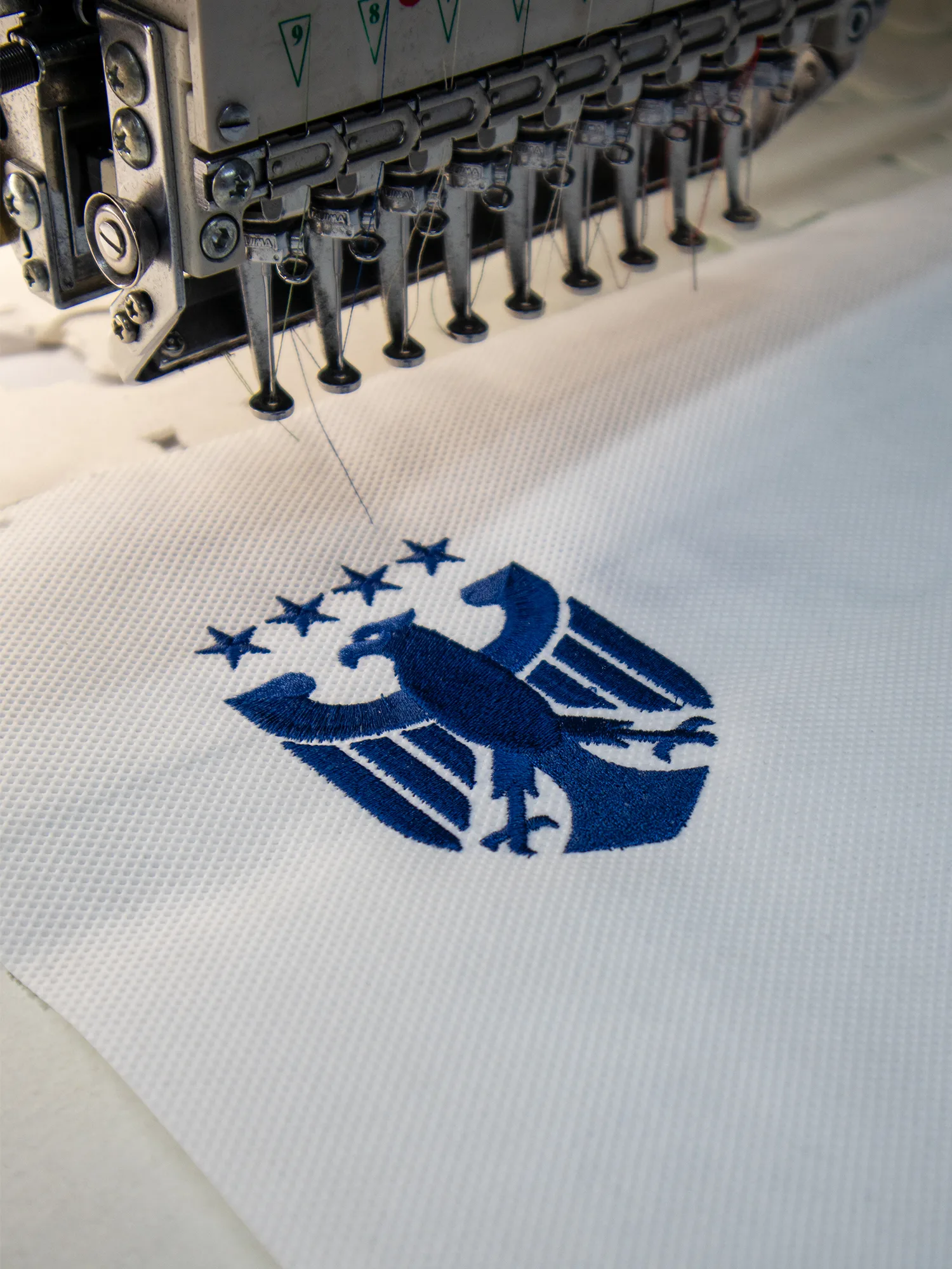 Custom logo applied to sportswear — 3D embroidery, flat embroidery and UV DTF