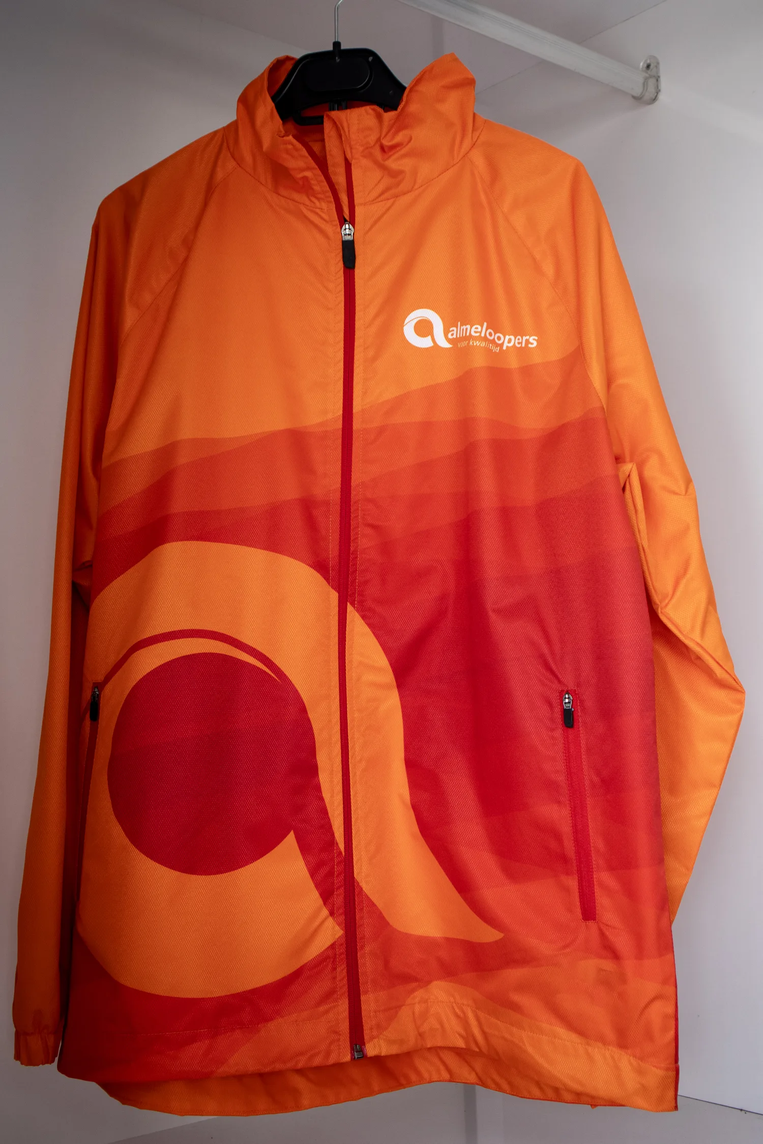 Custom white-label rain jacket manufactured for a sportswear brand